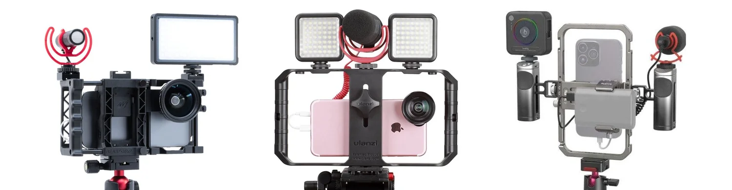 Three smartphone cages rigged with lights, a shotgun mic and a lens adapter, shown as the loaded setup rather than the outdoor grab.
