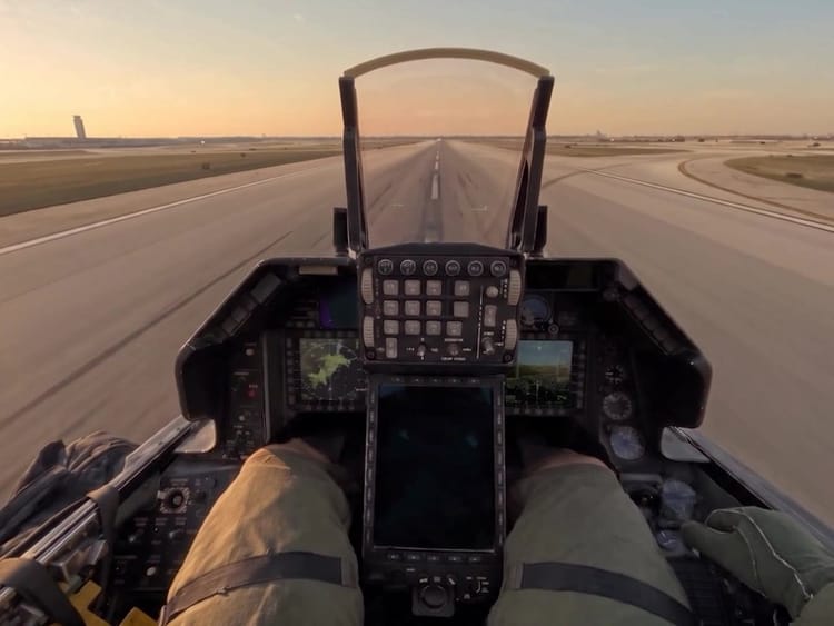 AI-generated still from the reel: the cockpit view of a fighter jet on a runway at sunset.