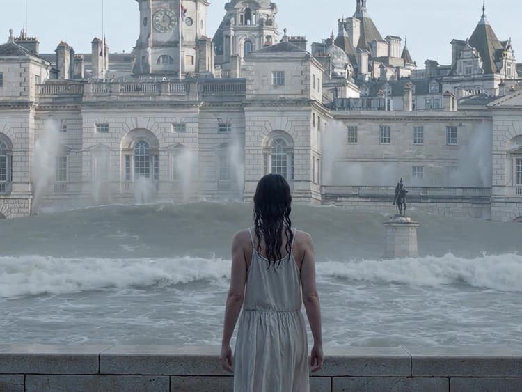 AI-generated still from the reel: a woman in white faces a huge wave breaking into a flooded classical courtyard.