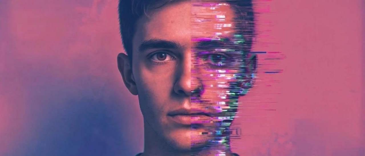 A man's face split by a glitch effect, half natural and half digitally distorted, on a purple background.